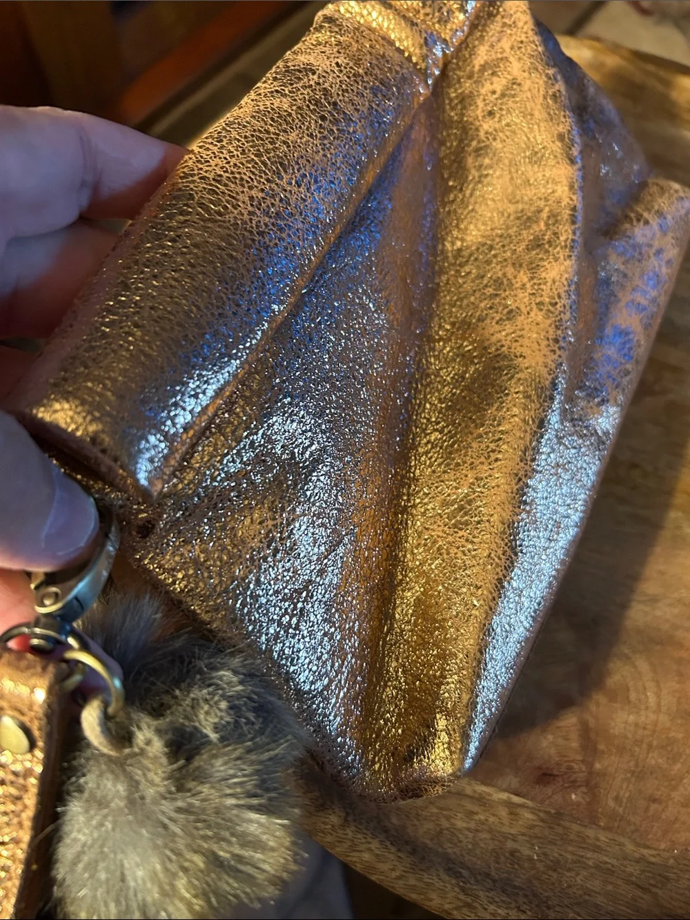 Miss Albright Metallic Bronze Zip Wristlet with Pom Pom Charm